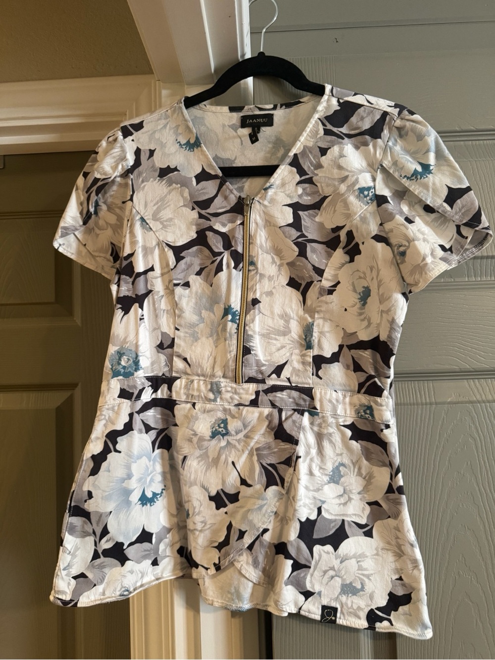 Jaanuu White Floral Zip-Front Scrub Top with Black & Teal Accents